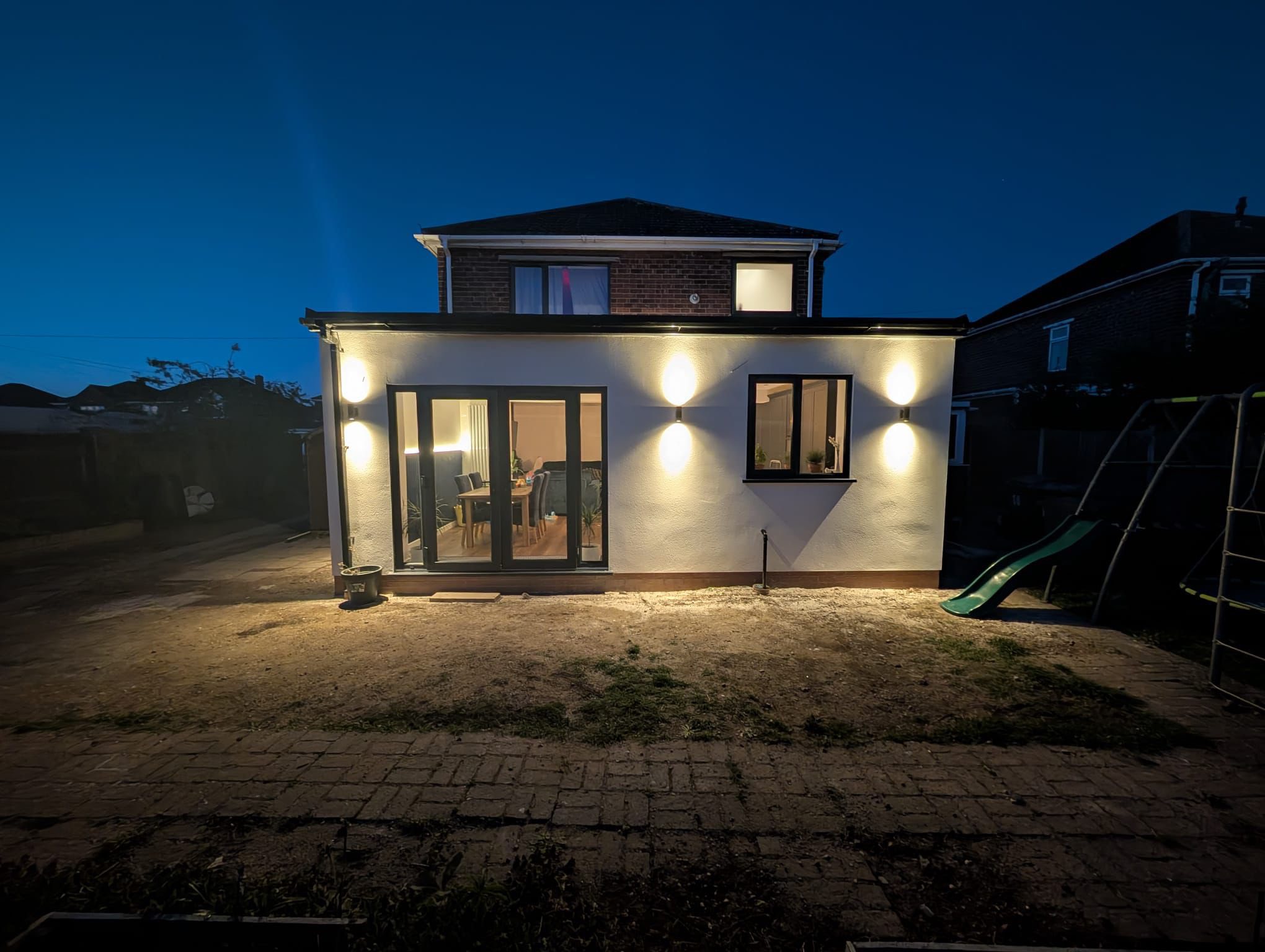 Back extension night view completed in Lincoln by Tudor Roofing and Building.