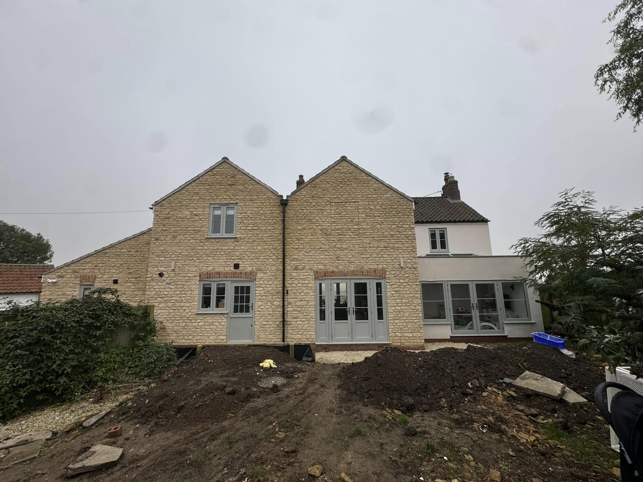 Stone extension front view in Lincolnshire showing newly built side elevation with natural stonework