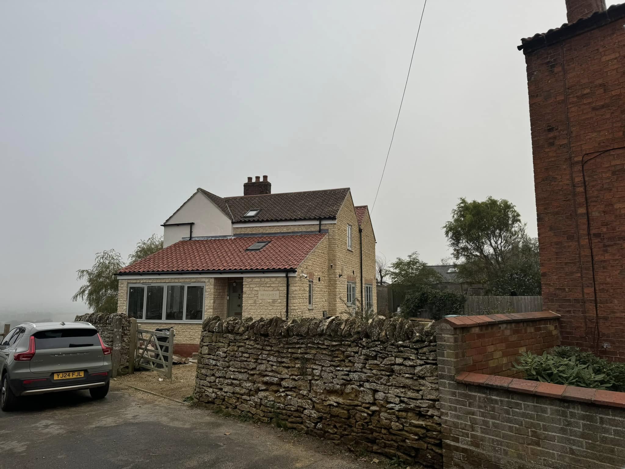 Stone extension side view in Lincolnshire showing newly built side elevation with natural stonework