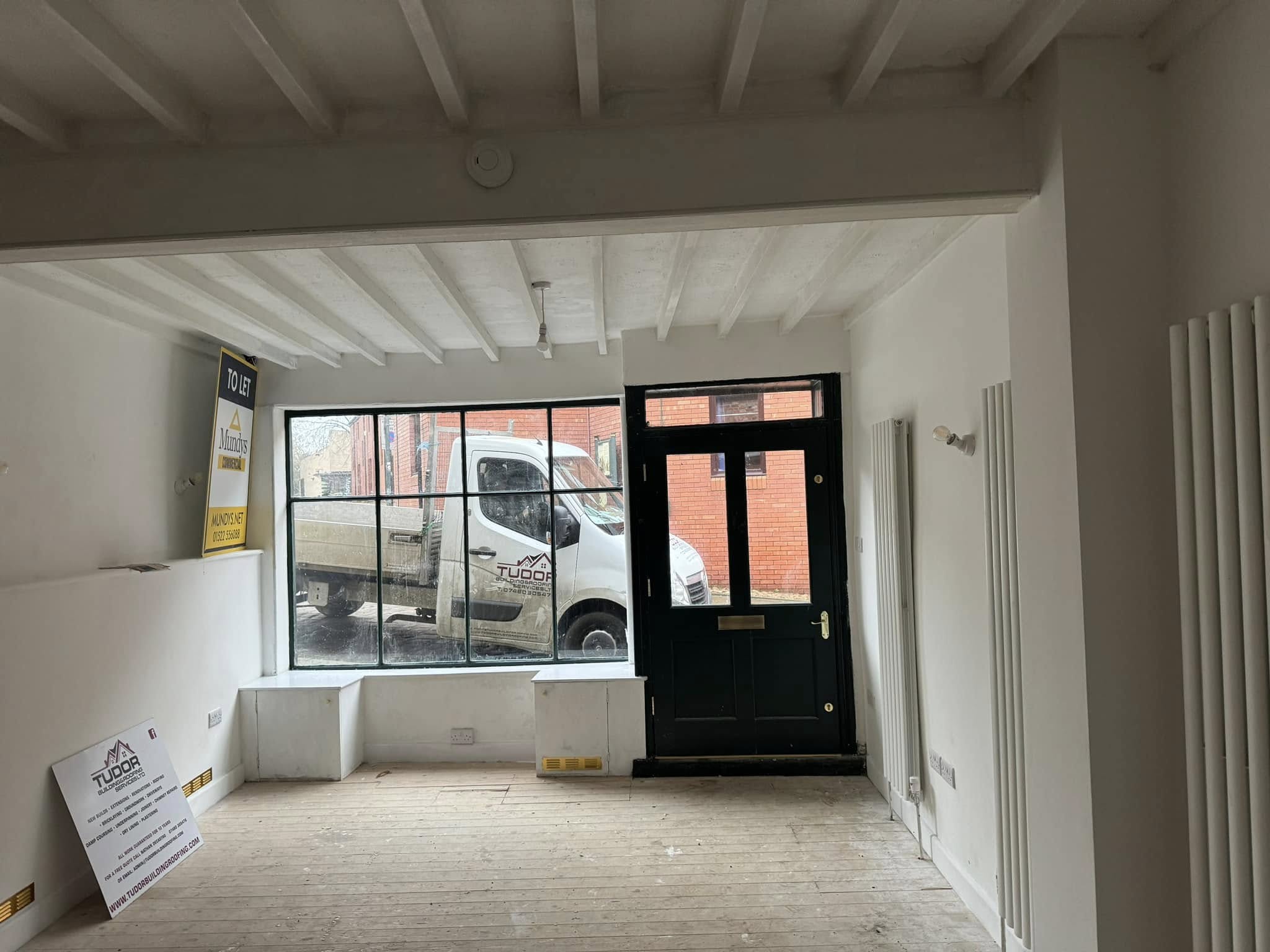 Listed building shop renovation in Lincoln featuring restored exterior and traditional construction work