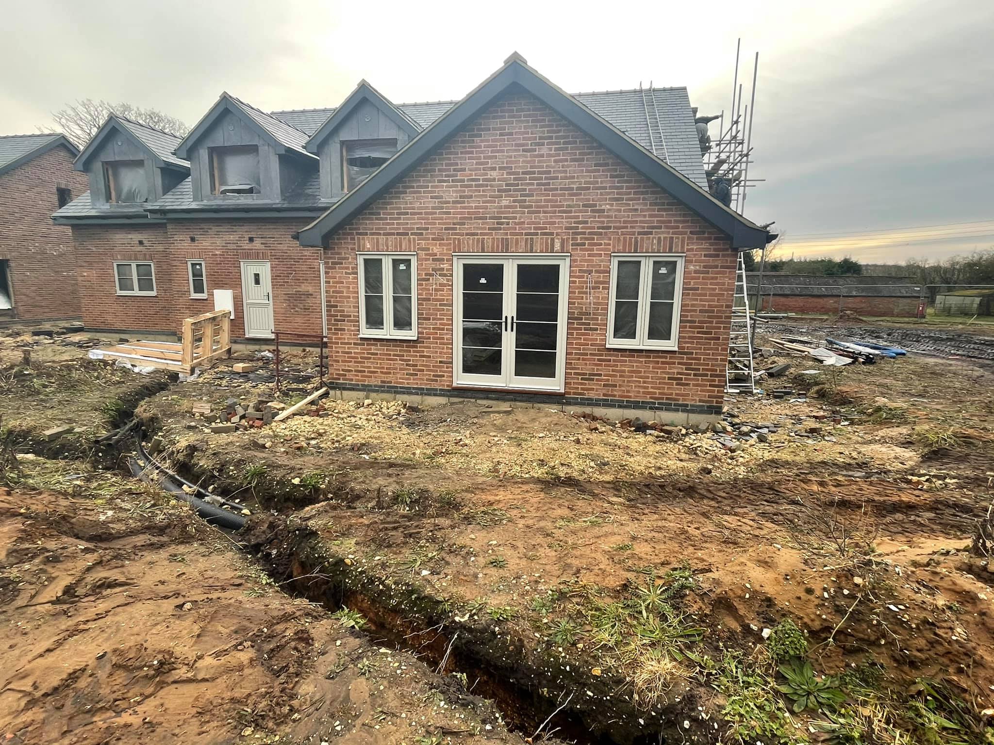 Front view of a new build home in Lincolnshire nearing completion with finished roof and brickwork