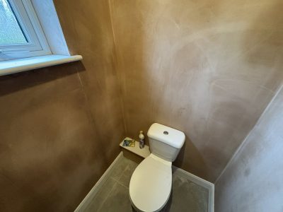 Toilet plastering in Lincolnshire showing smooth finished walls during interior renovation work